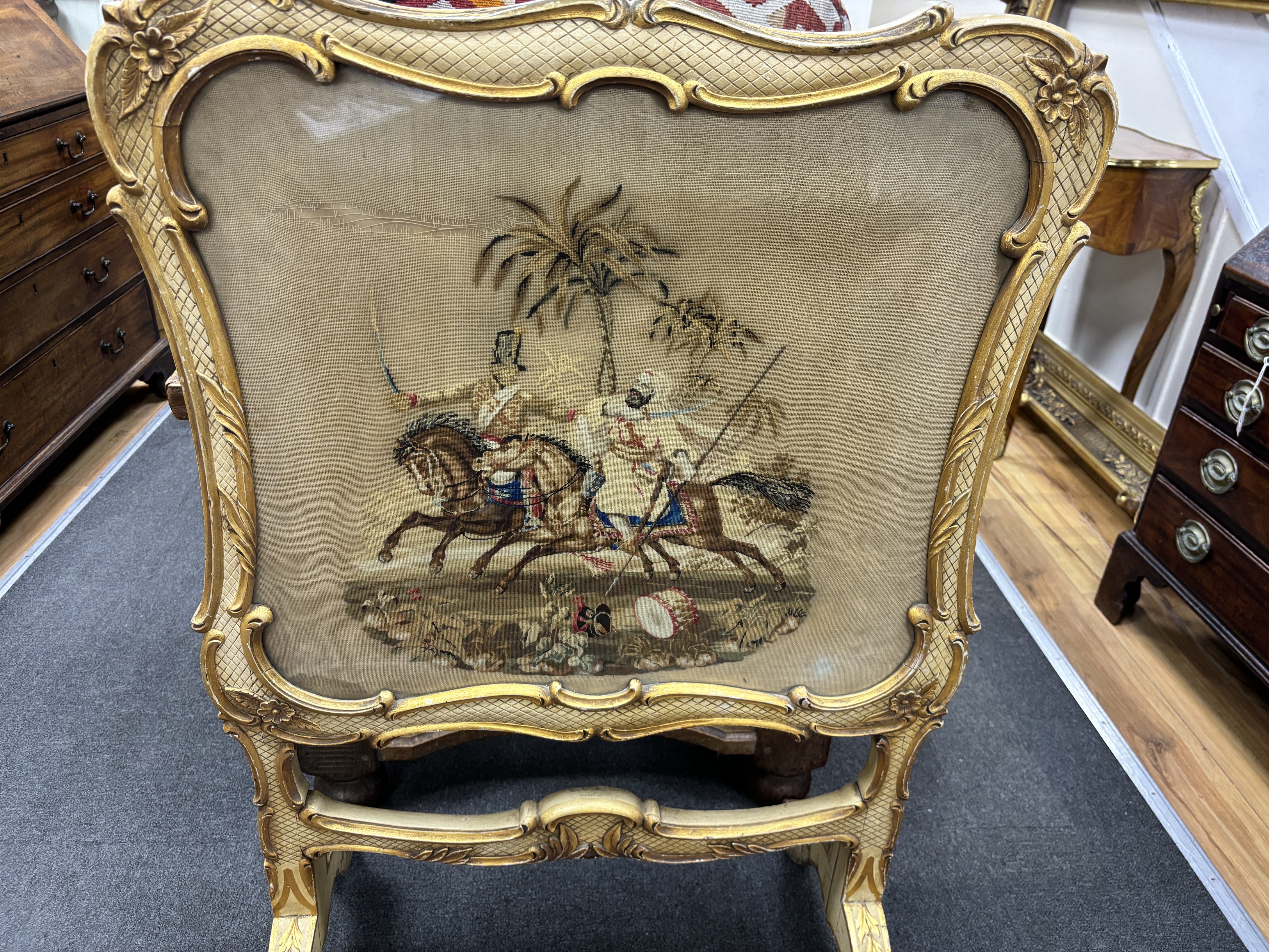 A Victorian cream painted firescreen with tapestry banner, width 74cm, height 115cm
